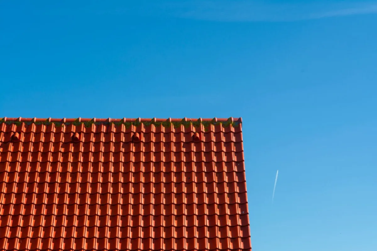 Tile roof gable in full sun, the kind of exposure that sets roof life in Delaware, OH
